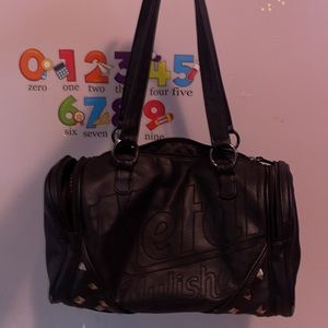 Black mini Metal Mulisha duffel bag.